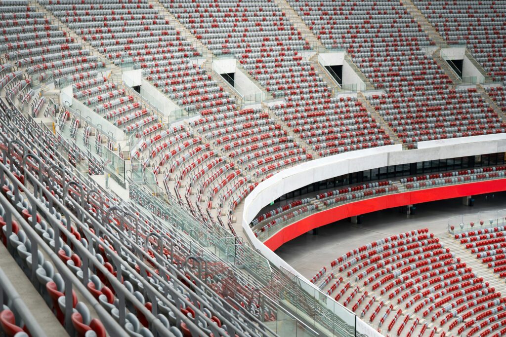 Aerial view of empty seats in Warsaw's National Stadium in Poland, showcasing rows and architecture.