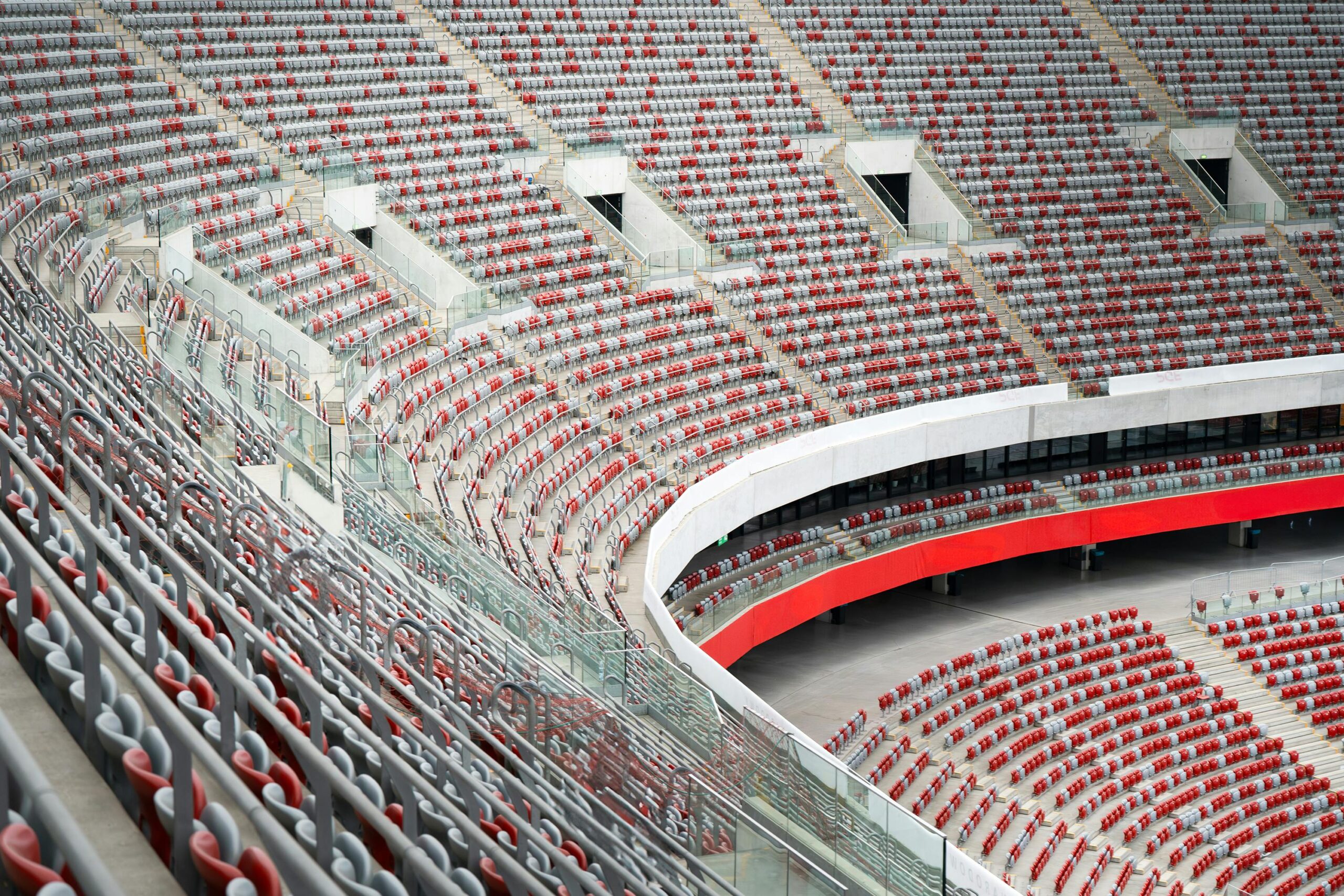 Aerial view of empty seats in Warsaw's National Stadium in Poland, showcasing rows and architecture.