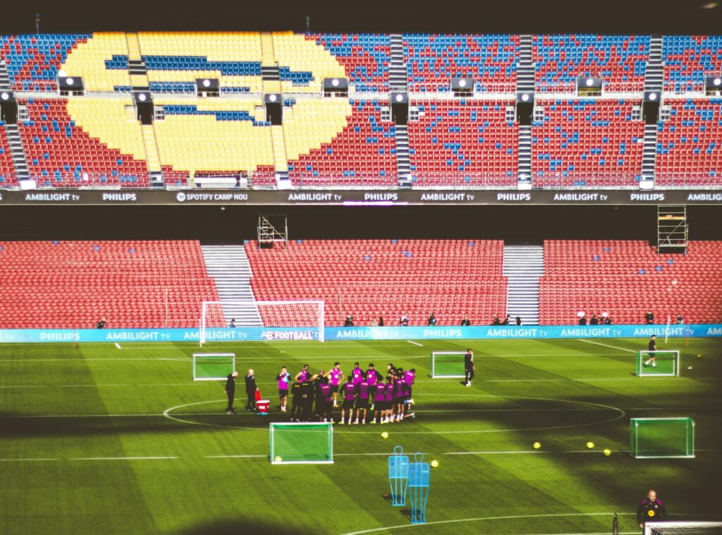 Soccer team practices on field at famous Barcelona stadium